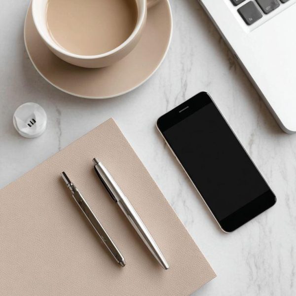 Minimalist Workspace Flatlay with Coffee, Smartphone, and Laptop for Productivity Inspiration